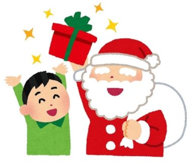 サンタさんが男の子にプレゼントを渡す画像